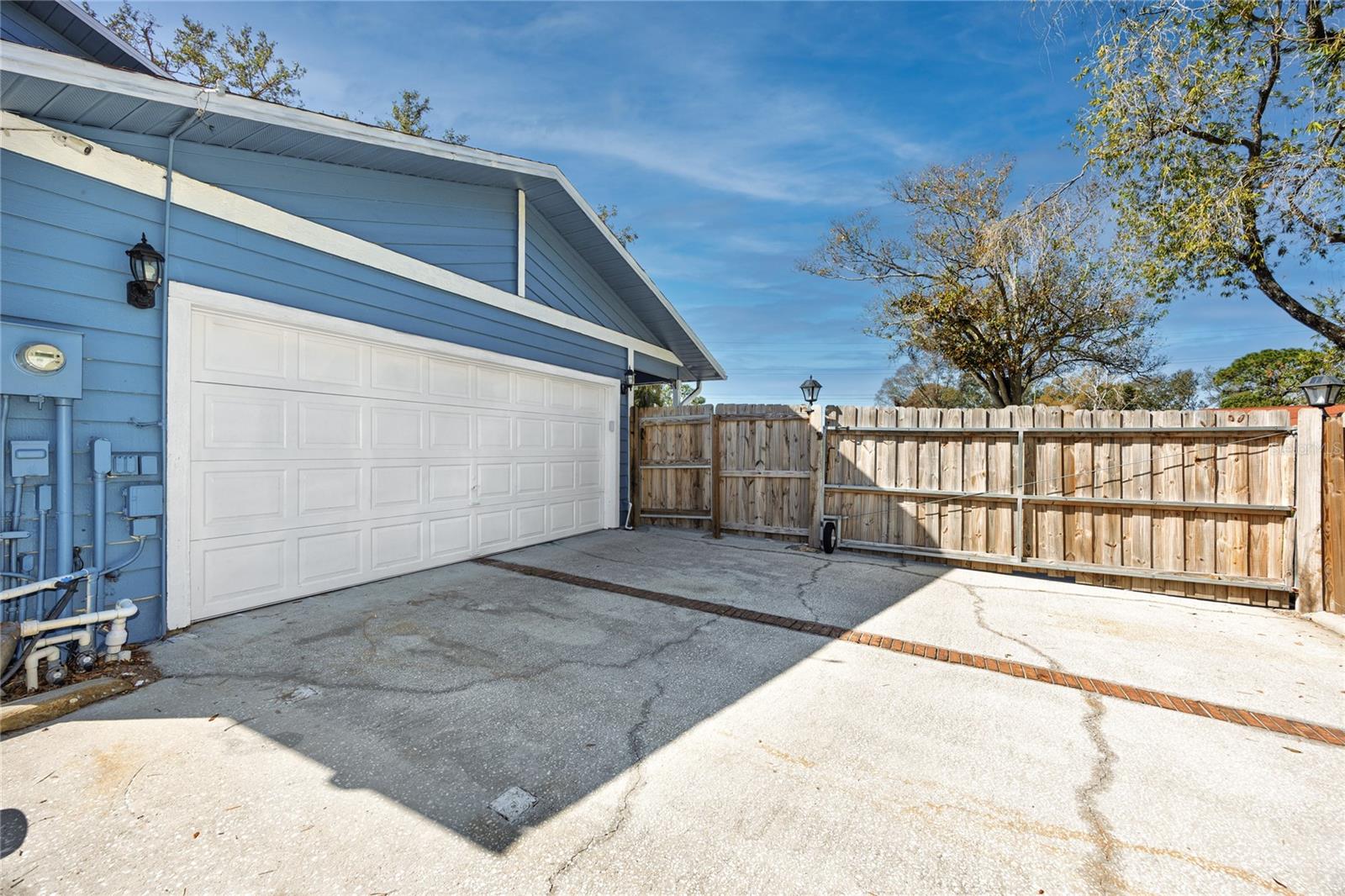 Garage in the main house and the gate to enter the property.