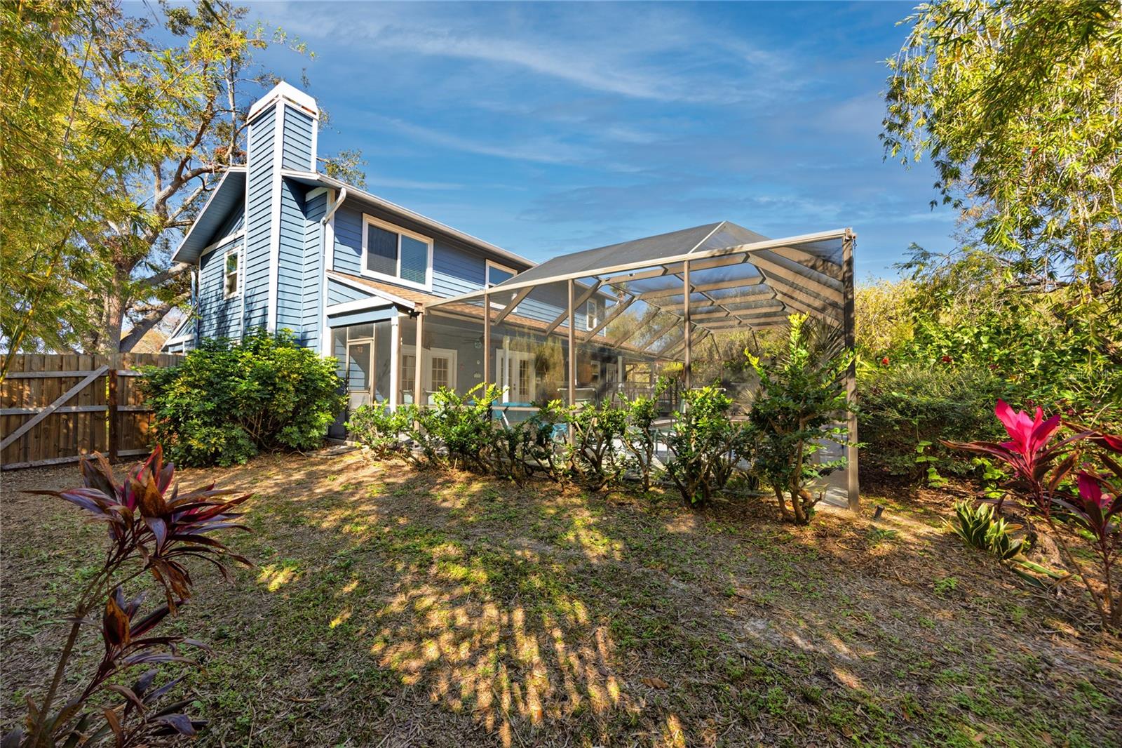 View of the screened pool from the side of South side of the property