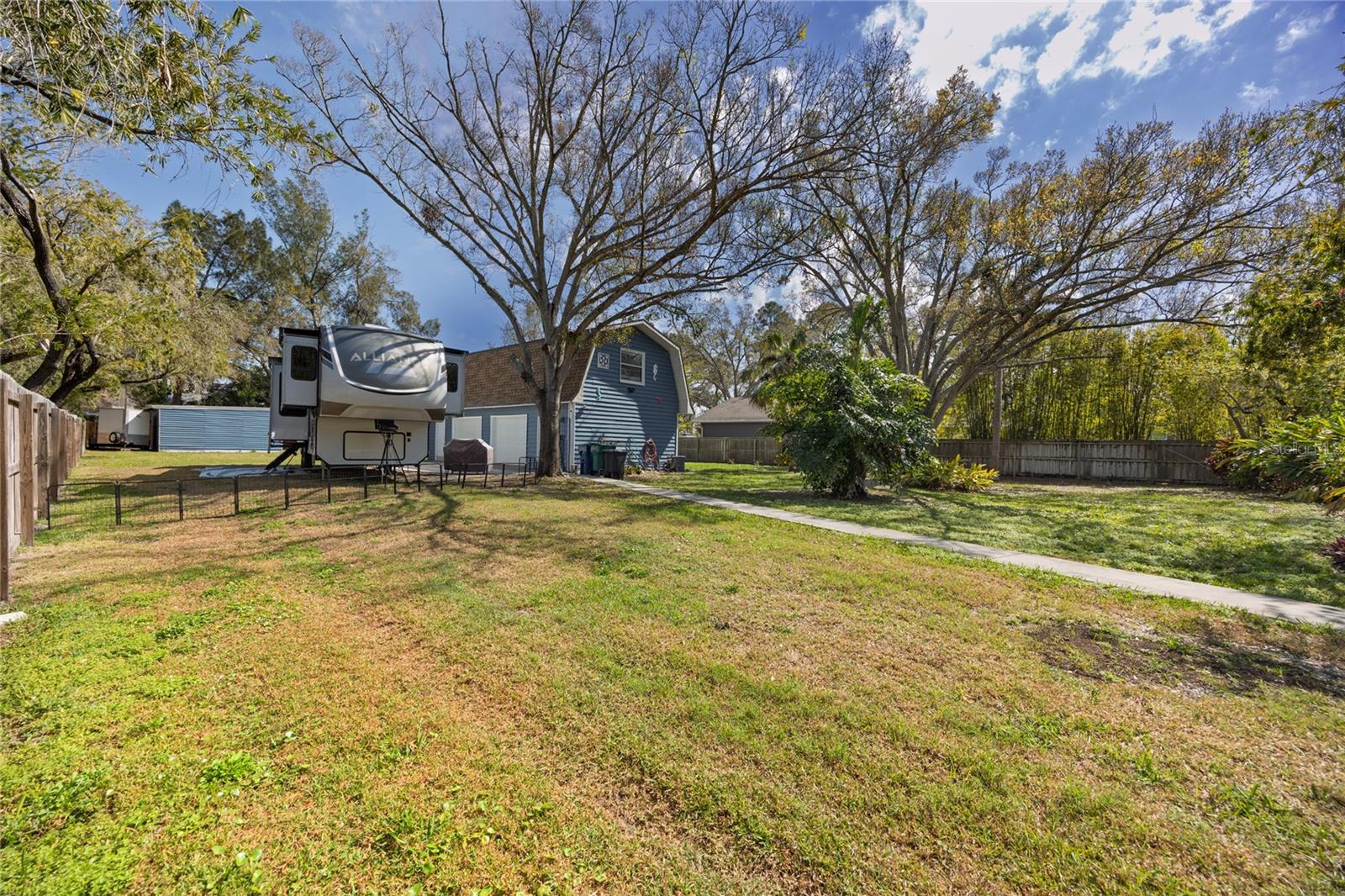 Guest house, owner's RV and barn/workshopt in the distance