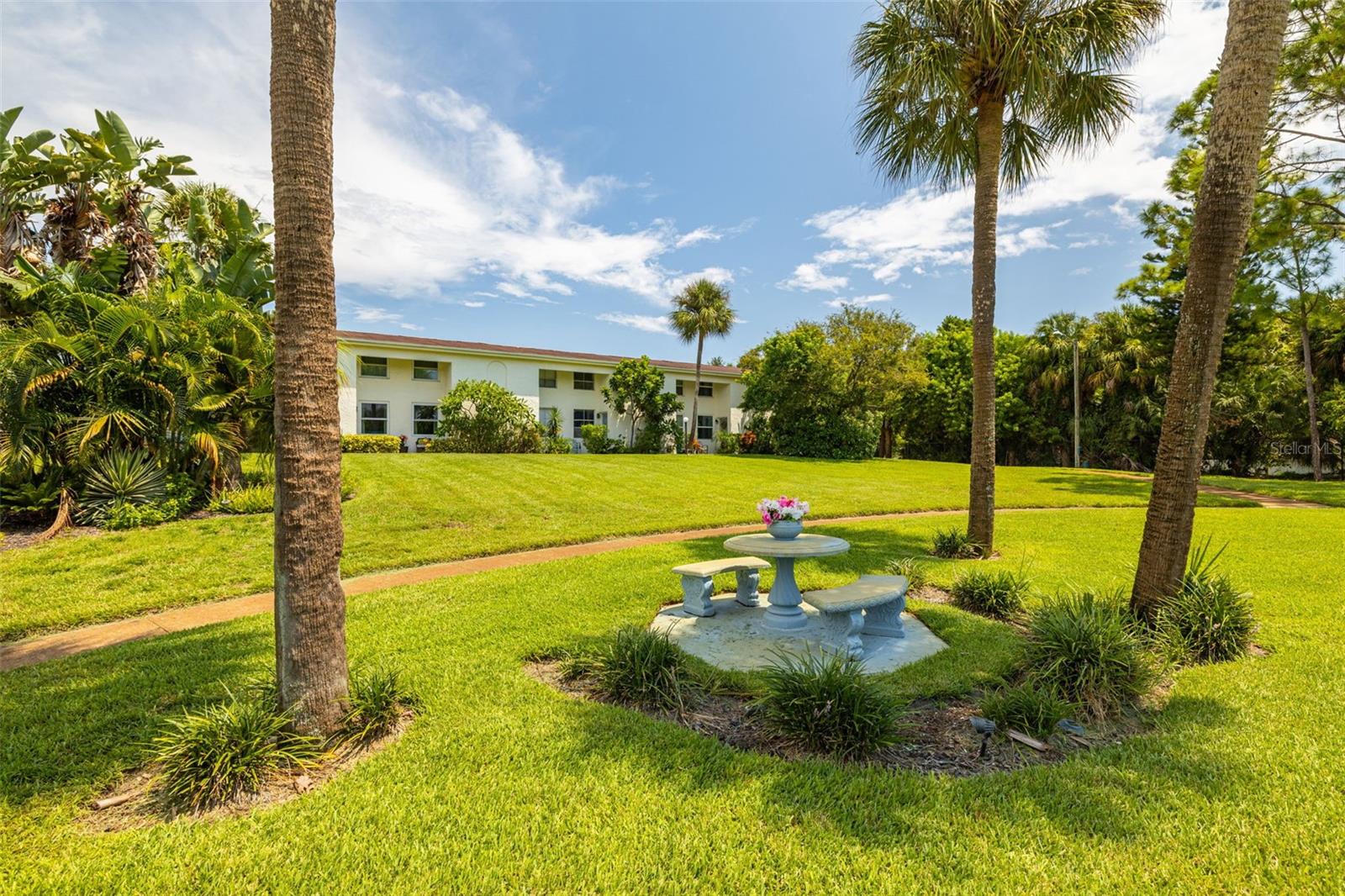 Front of building with view of park.