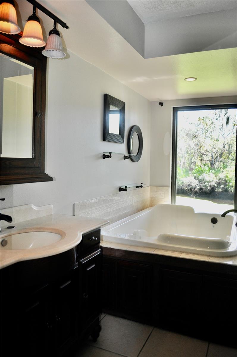 Master bathroom offers air-bubble soaking tub