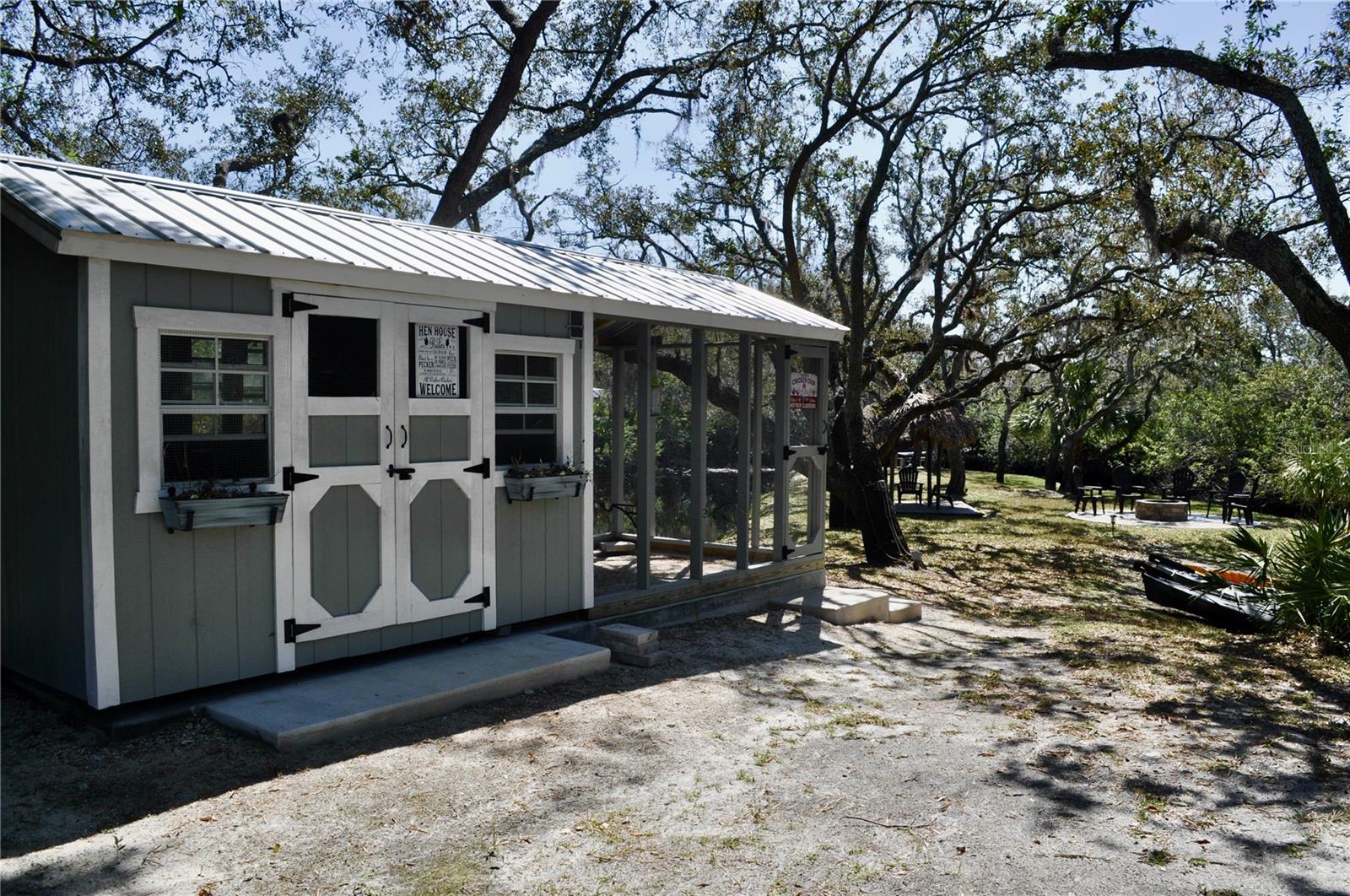 Chicken coop - featuring 2 hanging battery-operated chandeliers ensuring your feathered friends live in style.