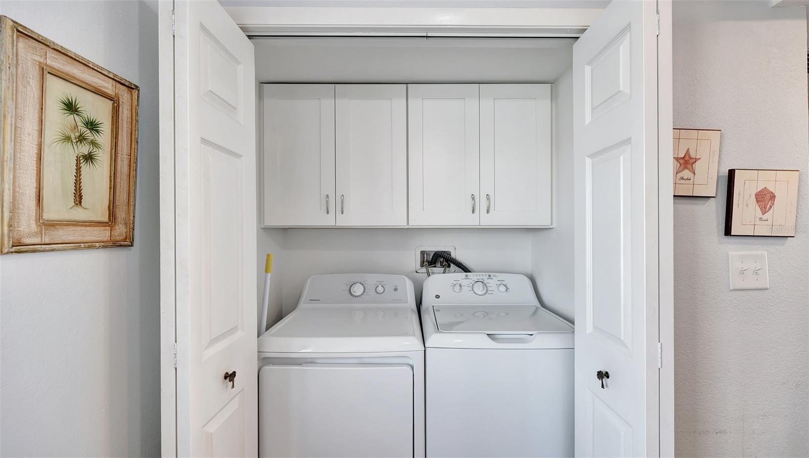 Laundry Closet with custom shelving. Washer and Dryer included.