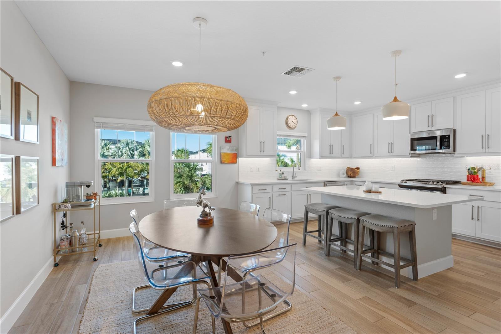 Dining area off spacious kitchen. White quartz with hints of veining. 46 X 72 in Island with loads of storage.