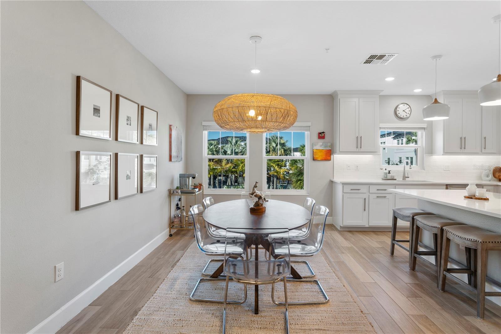 Dining area with outdoor views of the resort style pool area.