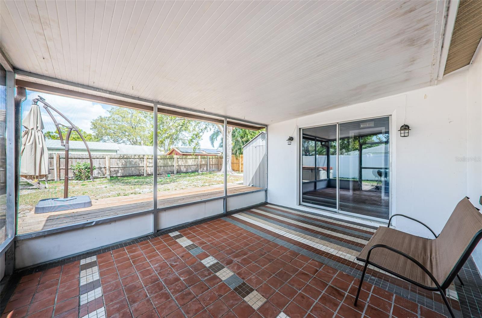 Covered and screened back porch