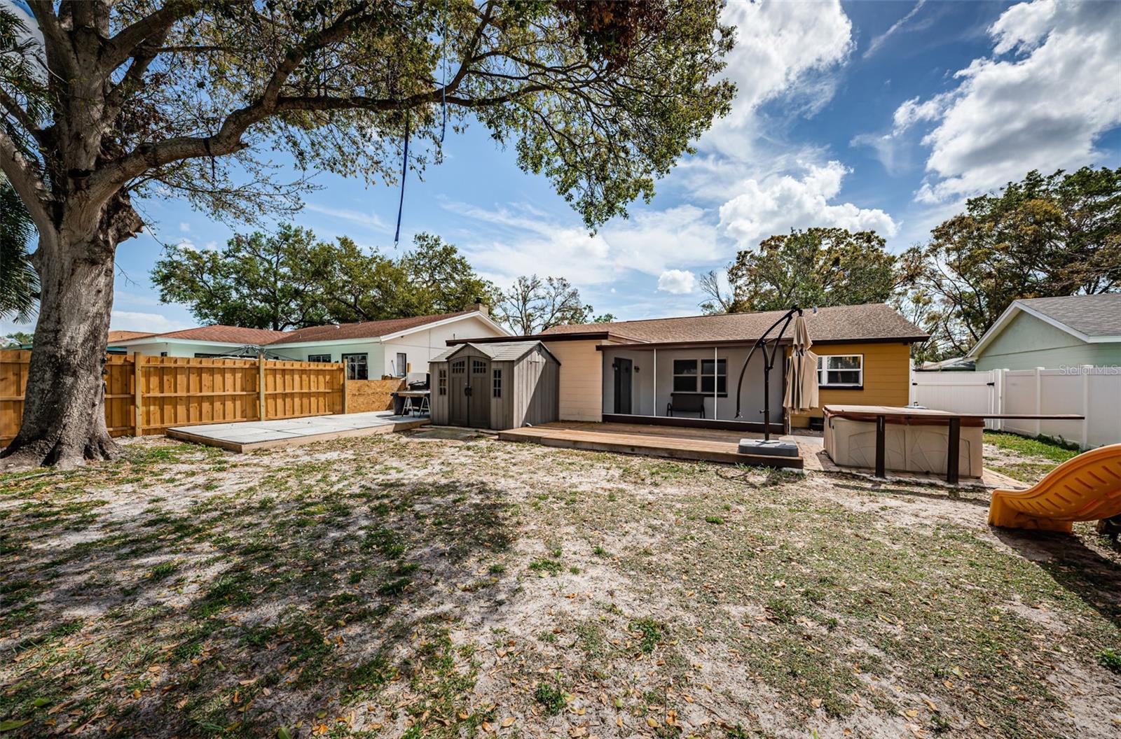 Big backyard featuring an outdoor patio and even space for a pool