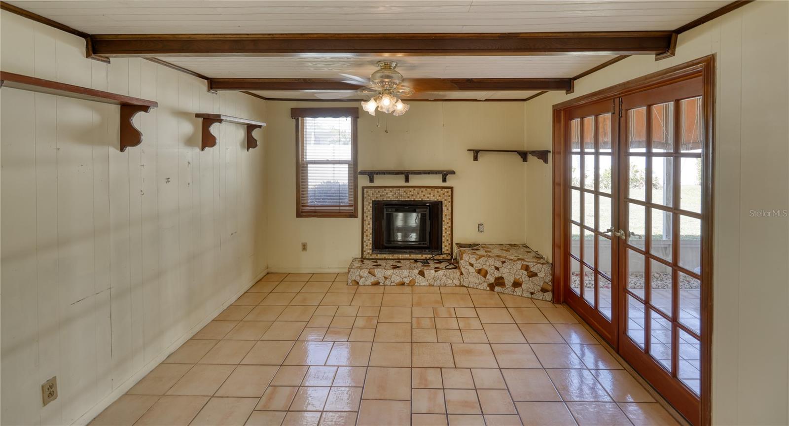 Bonus room with electric fireplace with chimney. Could be converted back to wood burning.