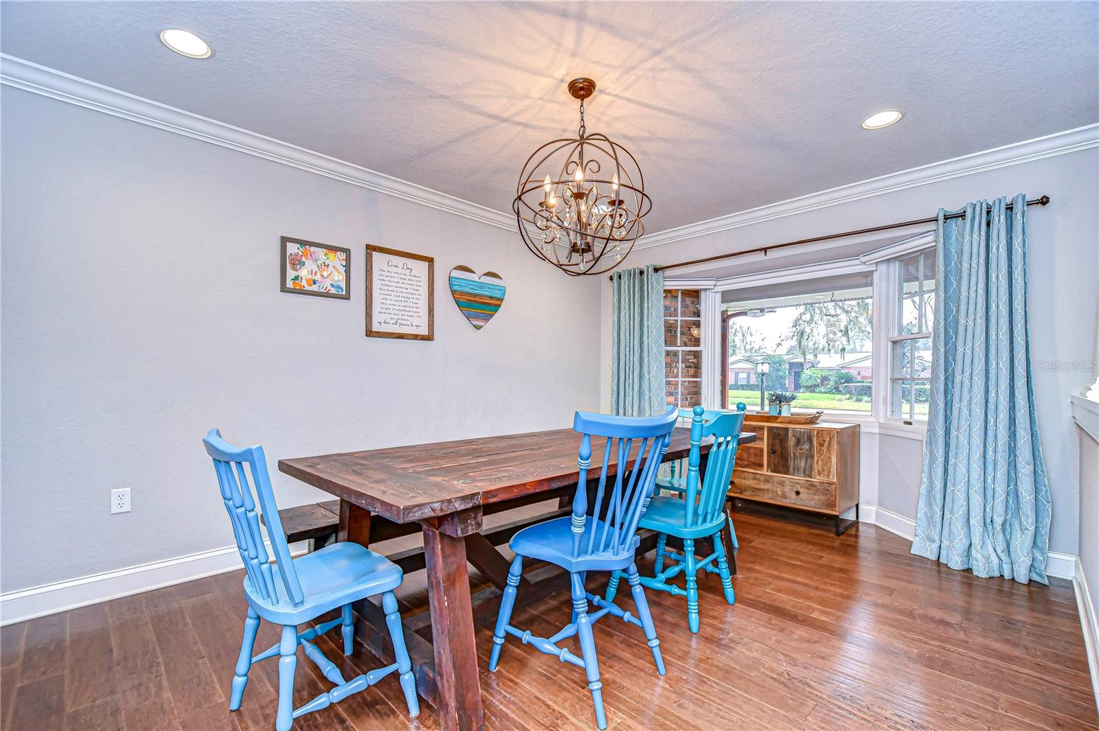 This charming dining space boasts ample space perfect for family gatherings.