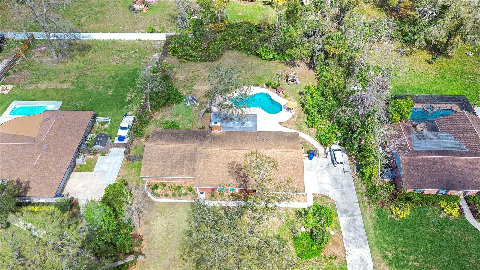 Nestled in a spacious lot, enjoy privacy and the lush, natural surroundings that make this home a tropical haven.