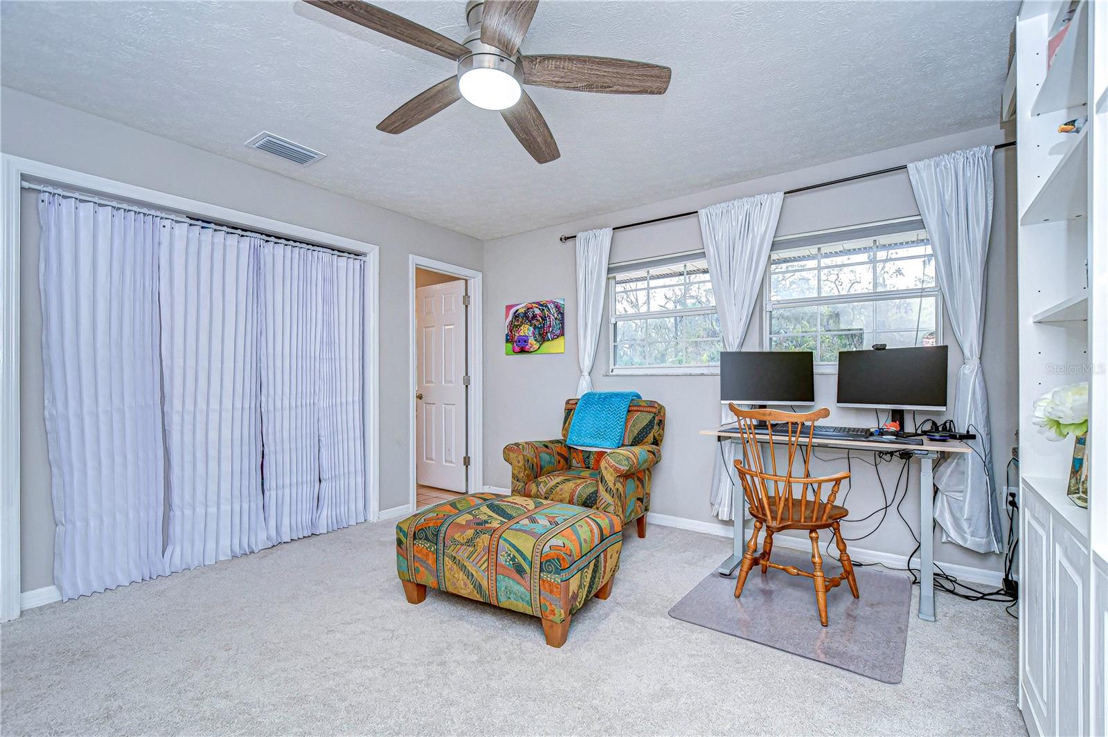 Fourth bedroom has ample space and natural light.