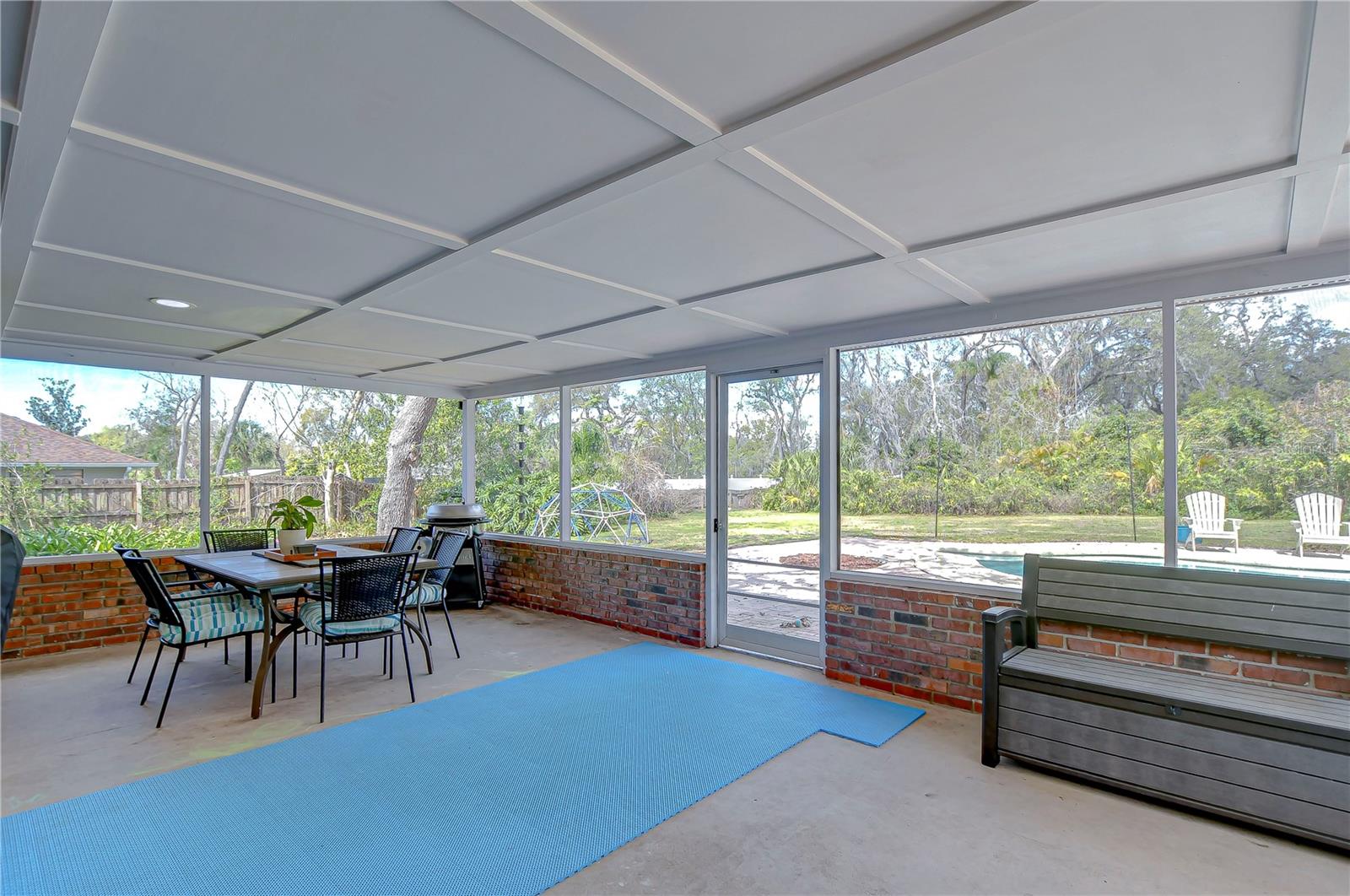 Step into your personal oasis with this delightful screened patio.