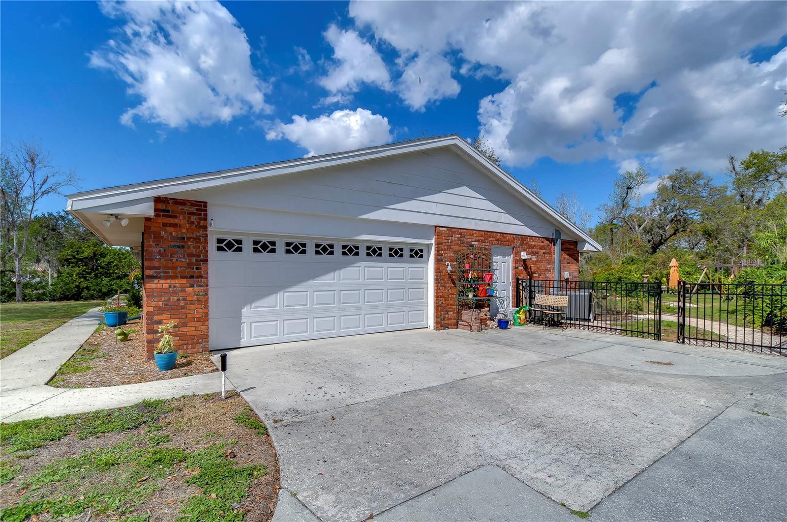 Charming suburban retreat with a spacious two-car garage, perfect for weekend projects or storing your gear.