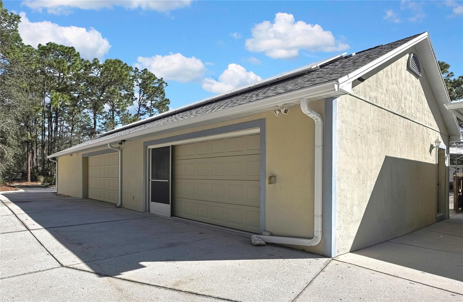 Seperate 7 Car Garage + Storage + Attic Storage. Solar Panels on Front and Back.