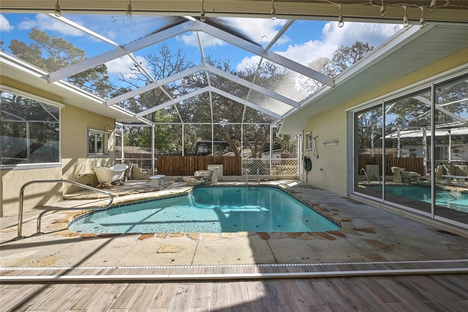 Pool Area - master windows and door on left, right are sliders for the seperate #4 room