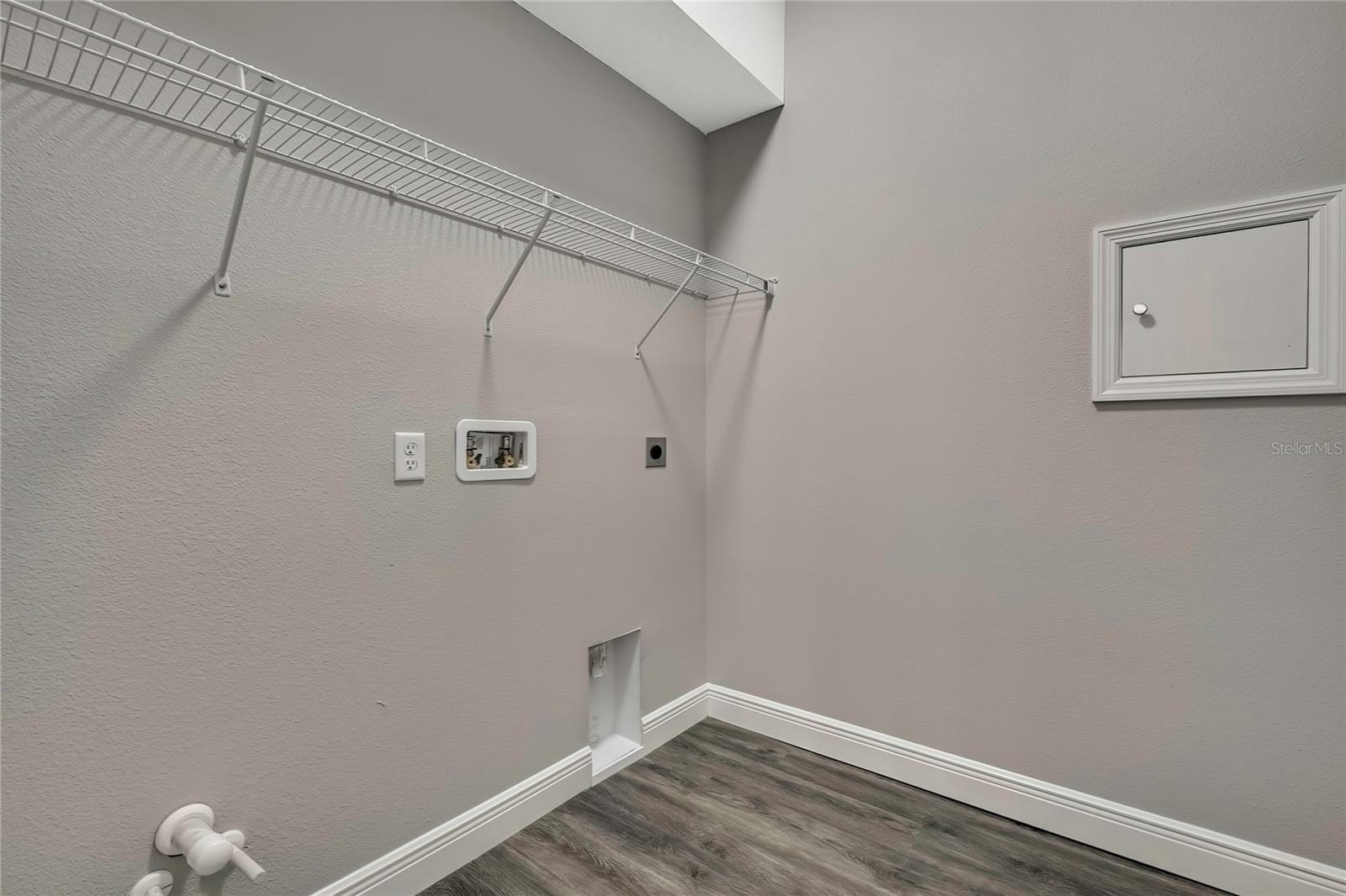 Utility room with laundry chute