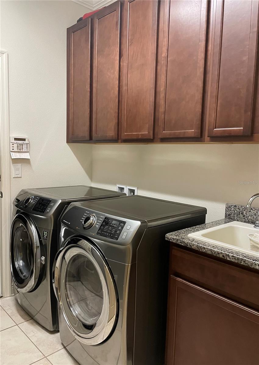 inside utility room with sink