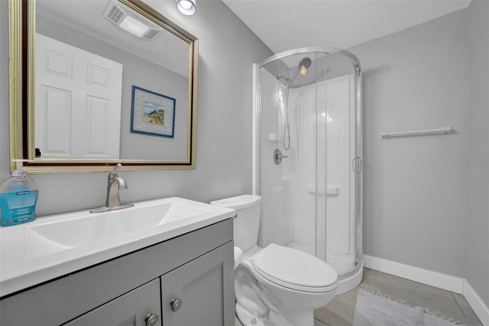 Remodeled bathroom located between Bedroom 2 & 3