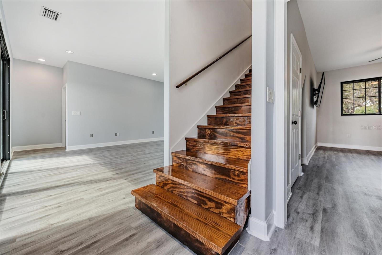 Gorgeous hardwood stair case adds a unique designer touch to the home!