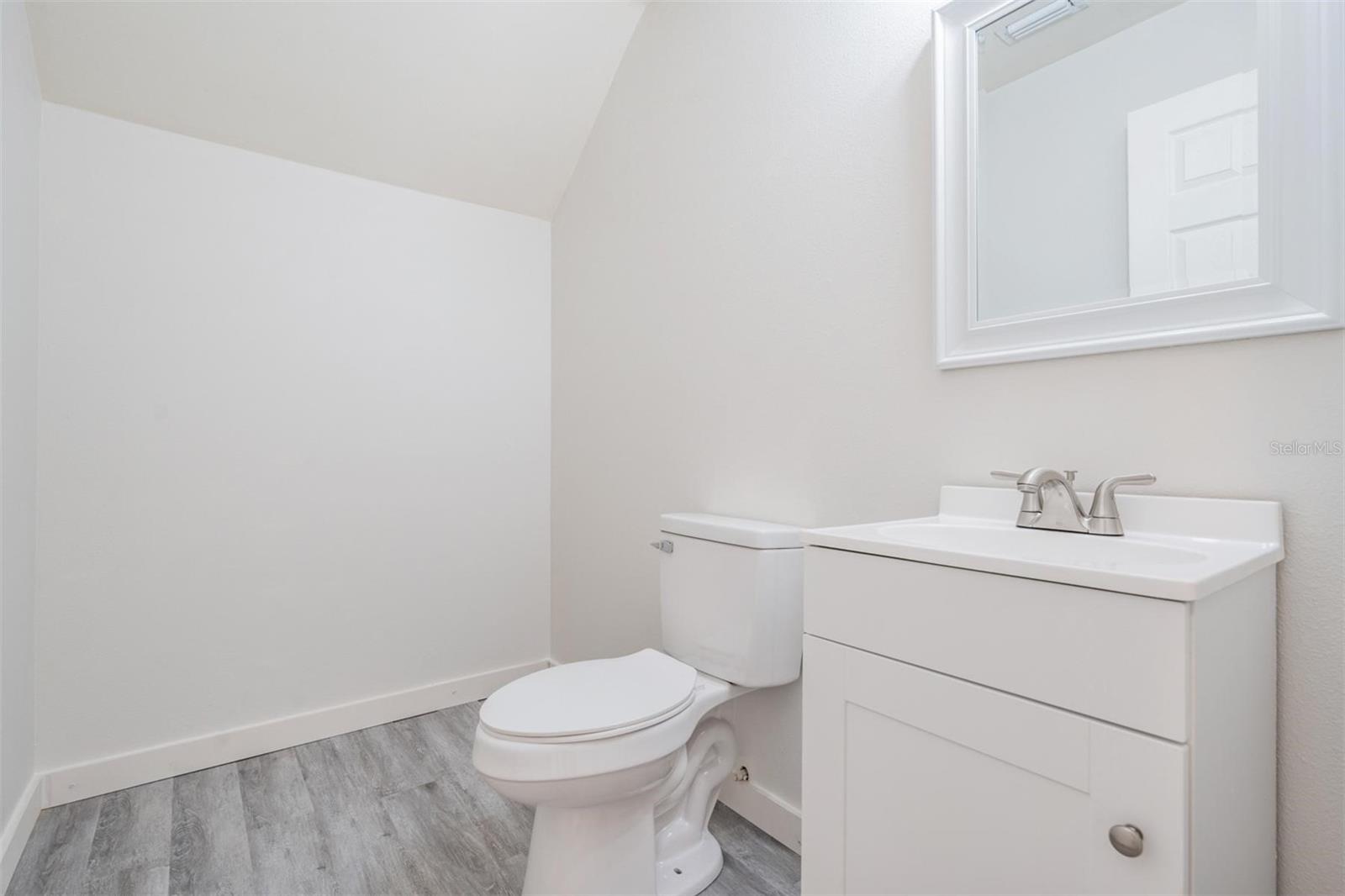 Half bath upstairs with plenty of room for tub or custom shower