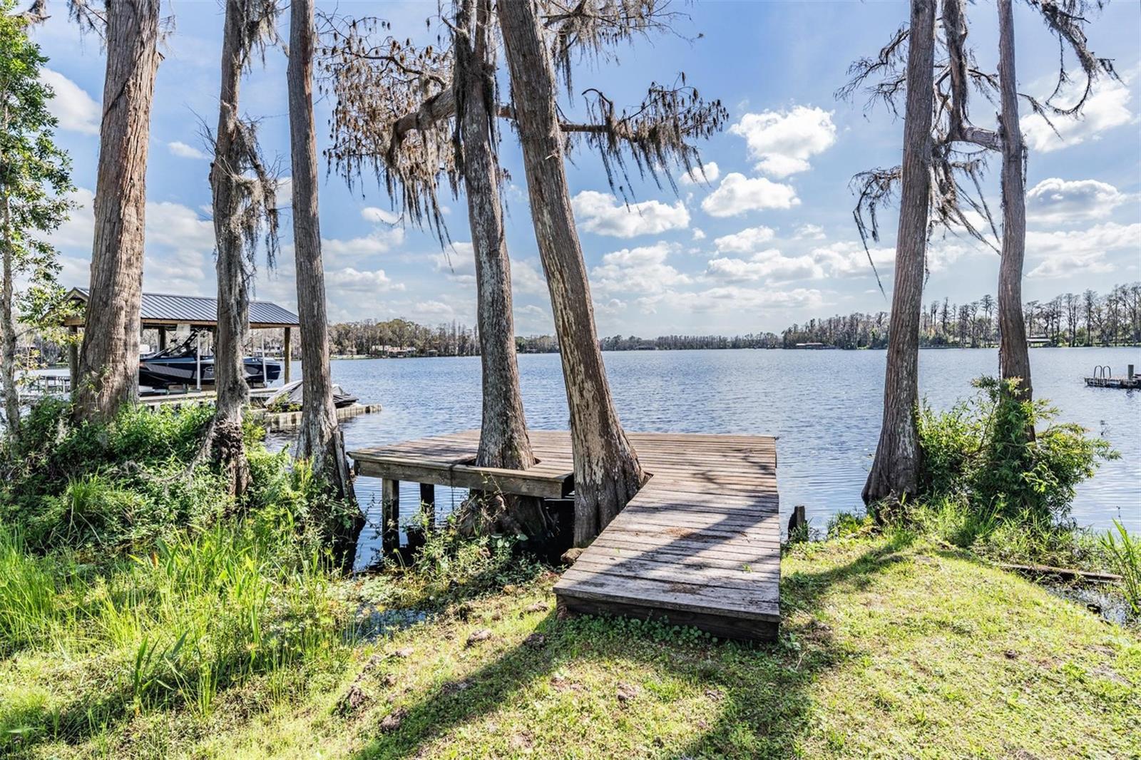 Plenty of room to add the boat dock of your choice with a boatlift or enjoy this one as it is!