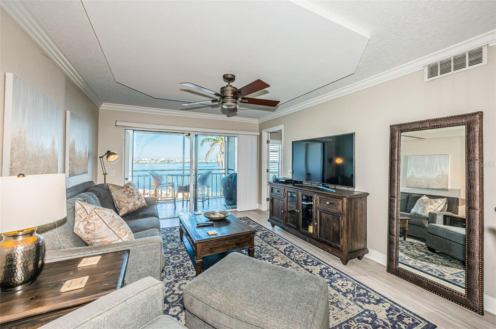 Main Living Area with Architecturally Enhanced Ceiling and Gorgeous Water View!