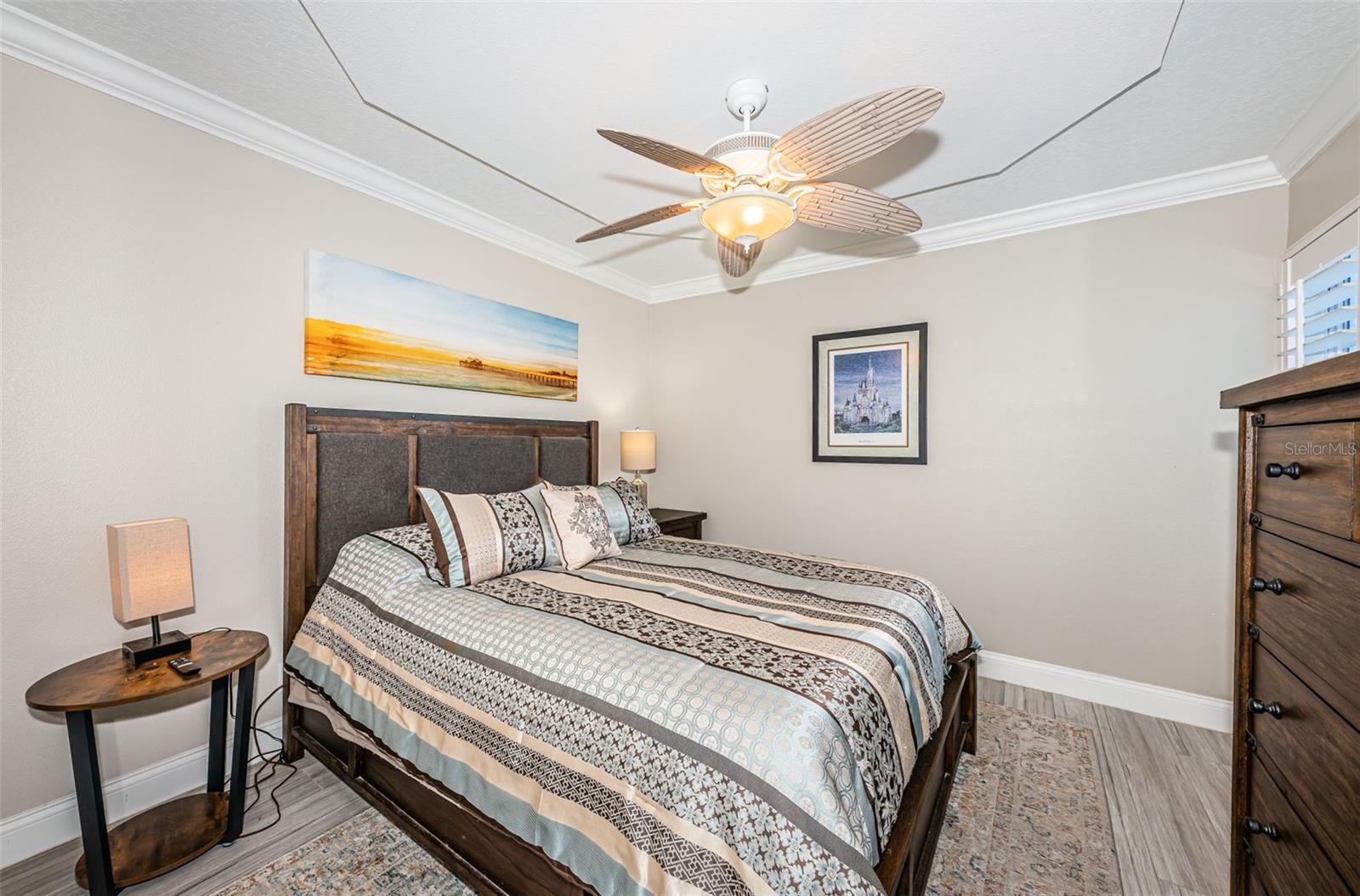 Guest Bedroom with Crown Molding & Architecturally Enhanced Ceiling