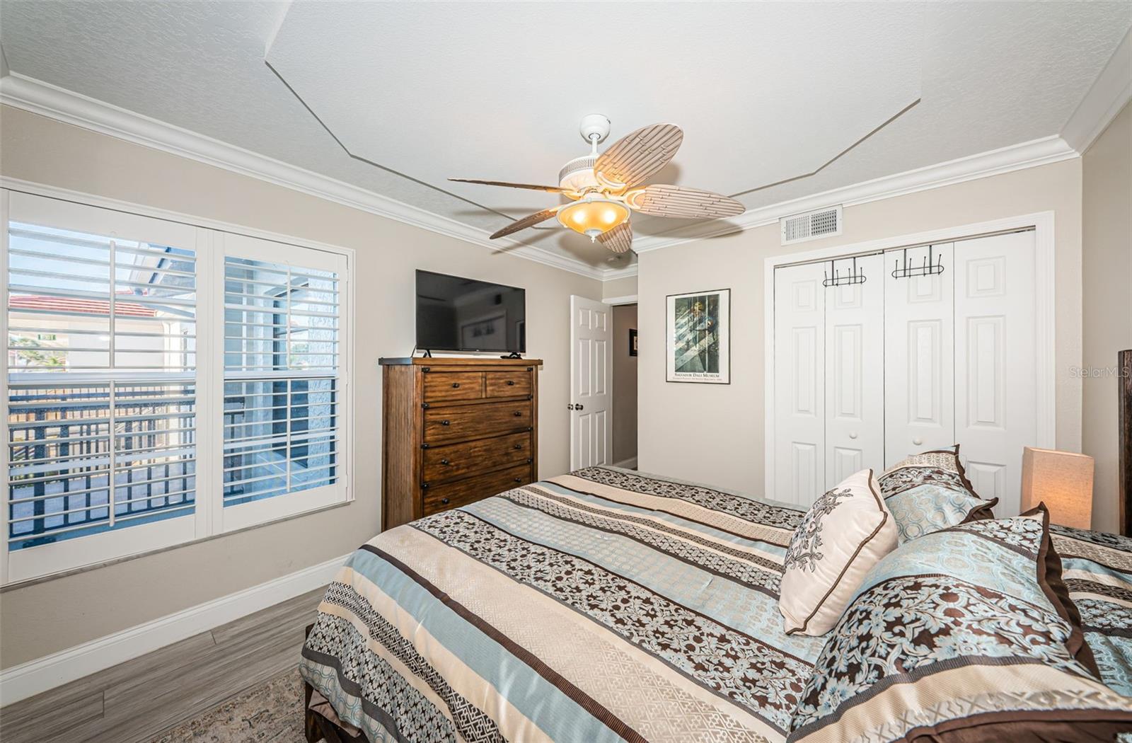 Guest Bedroom with Crown Molding & Architecturally Enhanced Ceiling