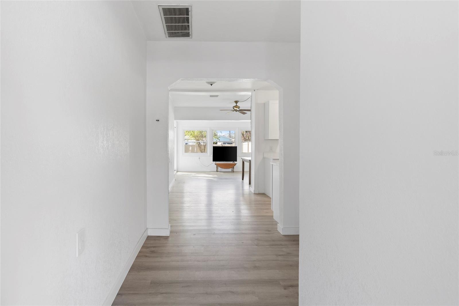 View from front door to the living room. Kitchen is to the right.