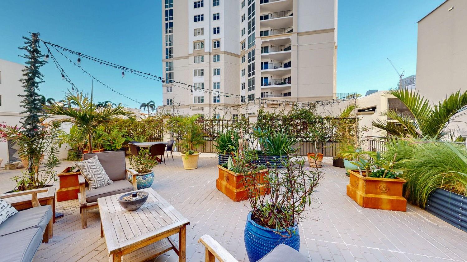 Part uncovered patio area with plants, sitting area, just UNbelievable !