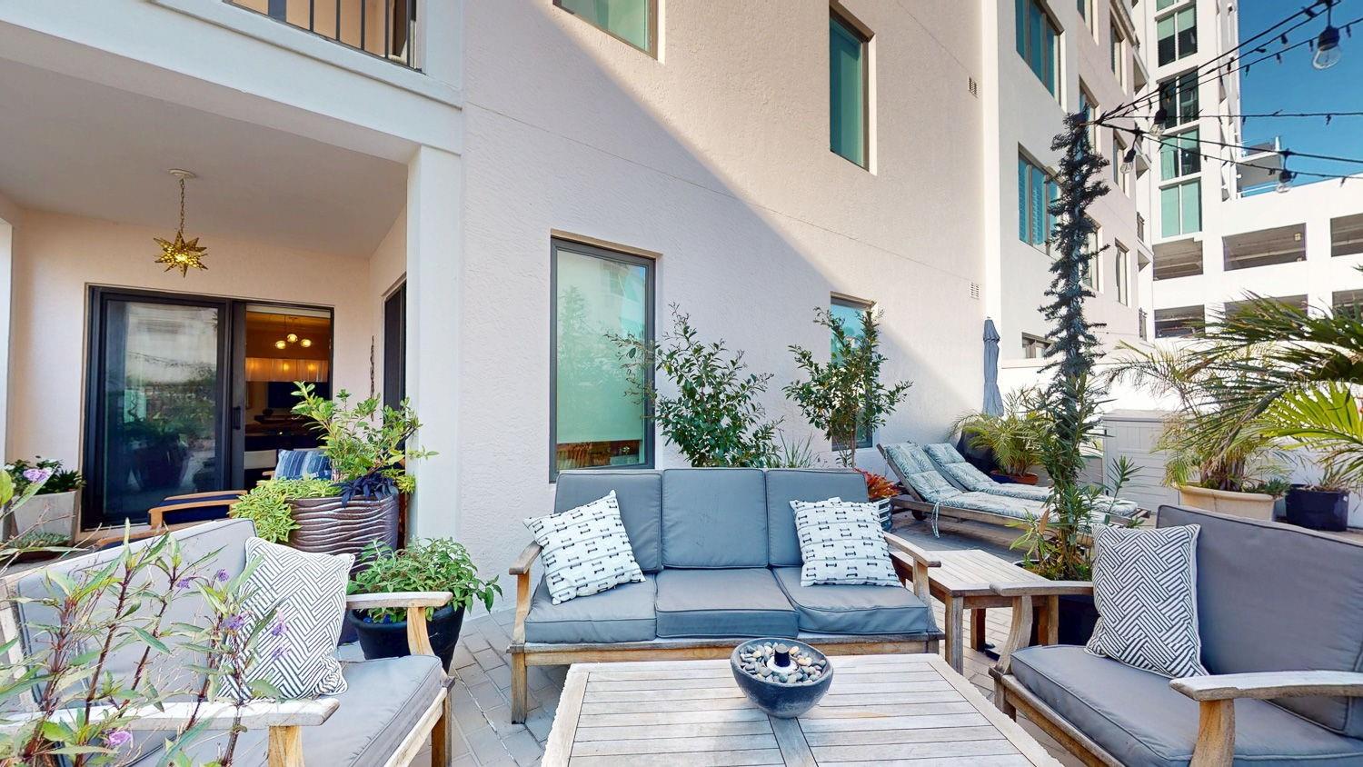 Sitting area with view of covered patio and sliding door to living room