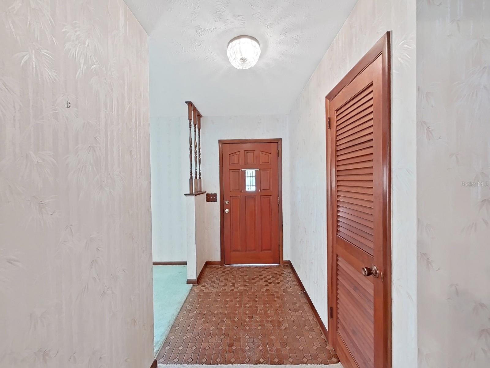 Foyer entry with coat closet