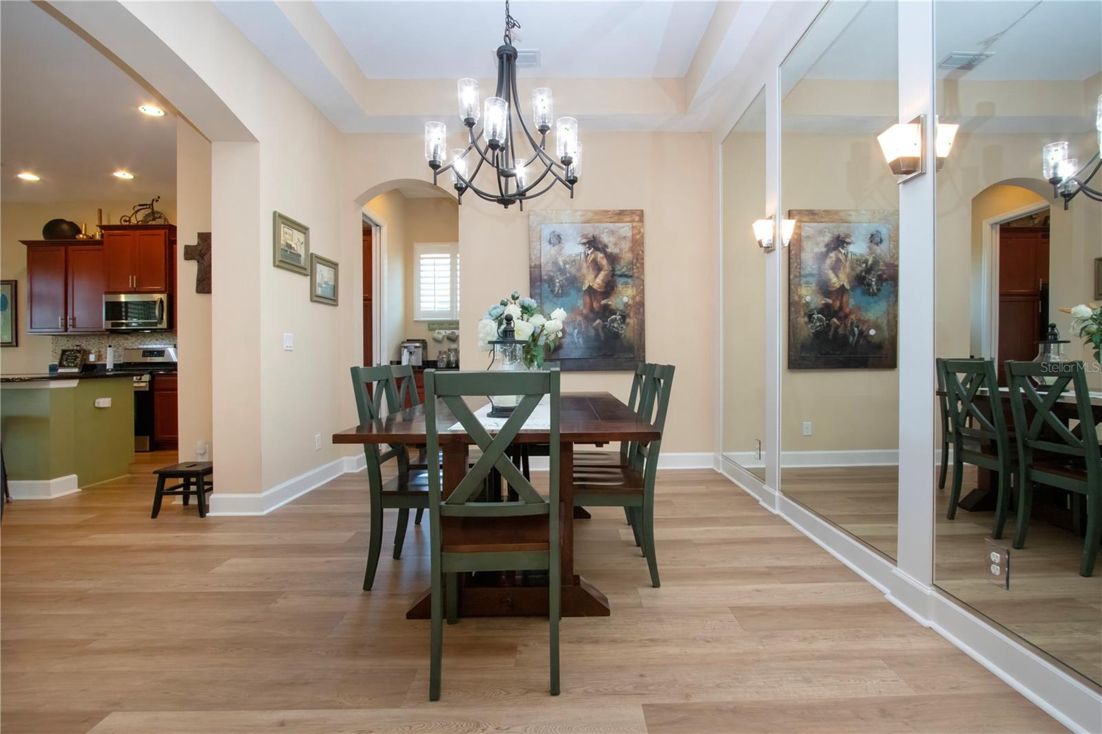 Dining Room with new chandelier in beautiful tray ceiling