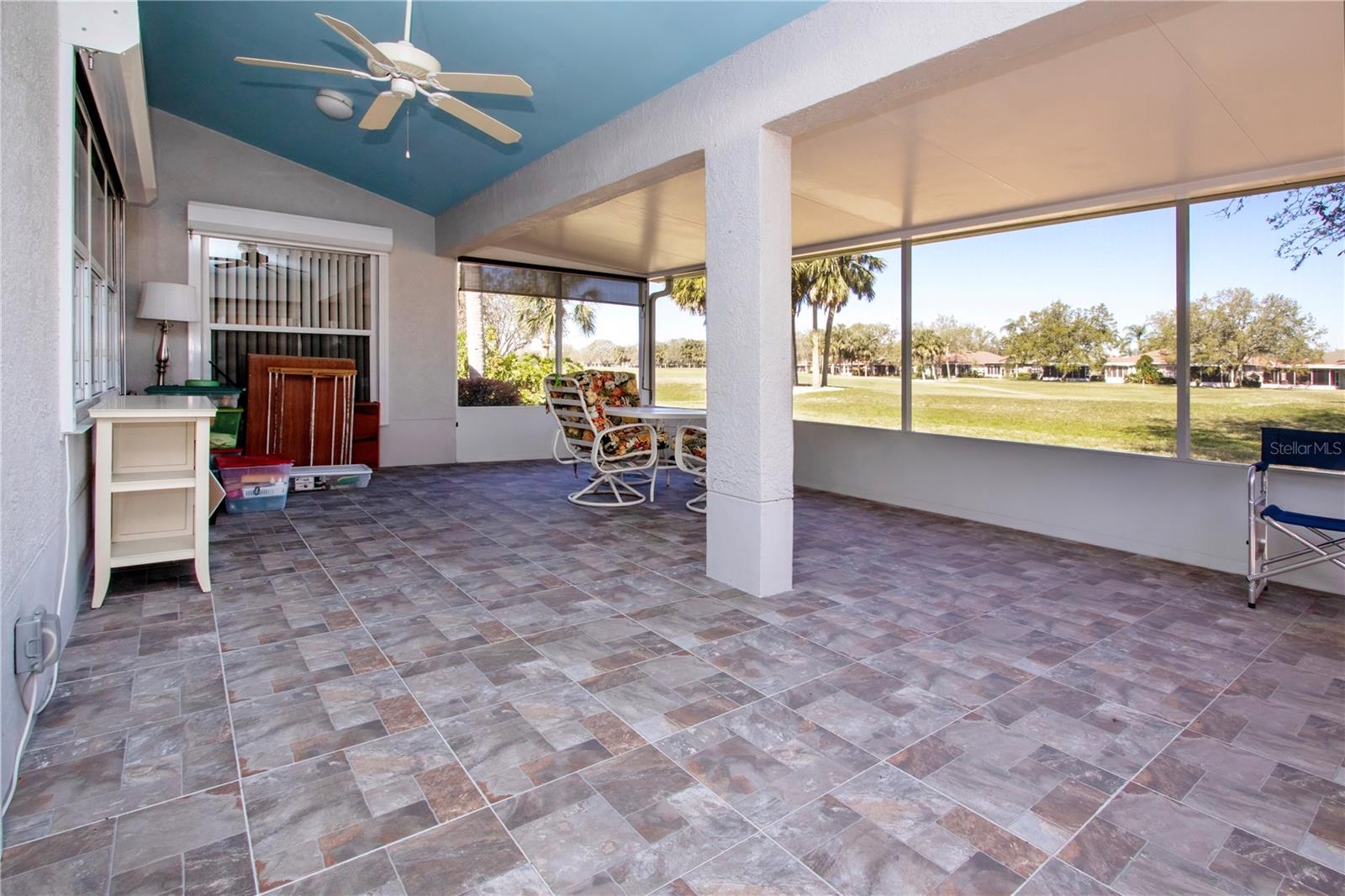 Expansive Covered, screened & tiled Lanai