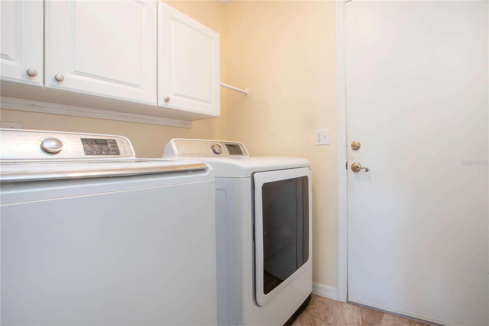 Inside Laundry Room w/storage cabinets