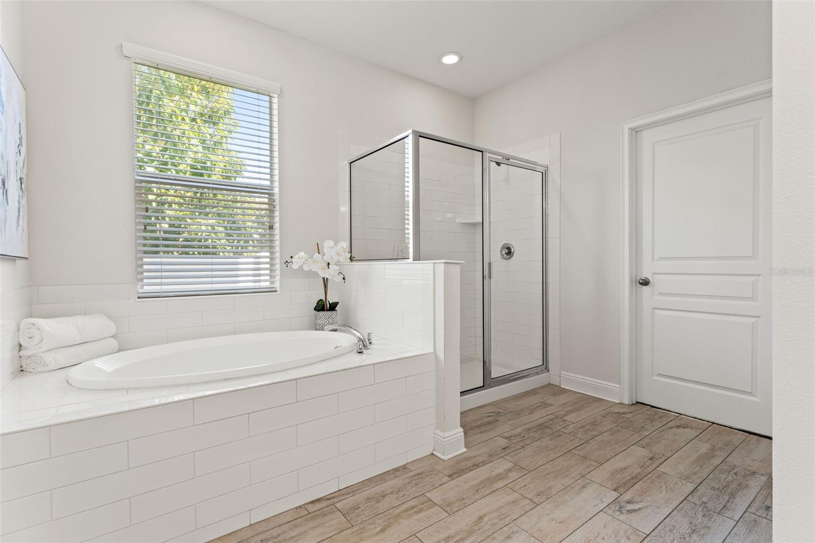 Primary bathroom on first floor with tub & shower