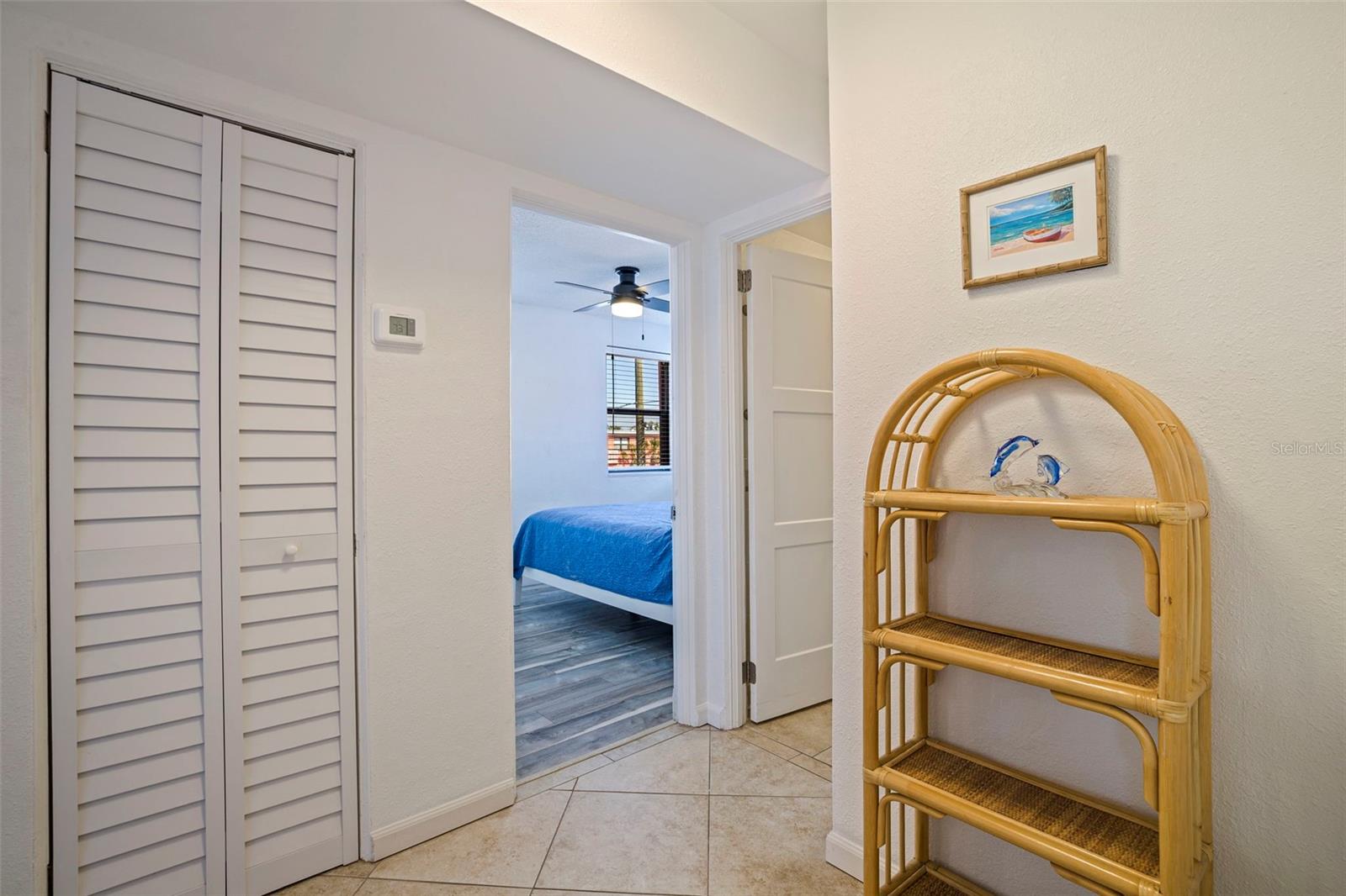 Hallway features a locking owner's closet plus additional storage closet