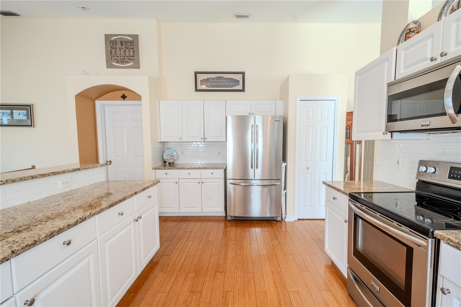 The kitchen has an abundance of counter space ideal for food prep and a closet pantry.