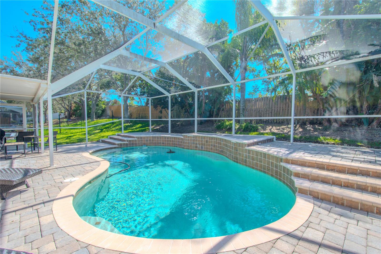 The in ground pool  features an elevated sun deck.