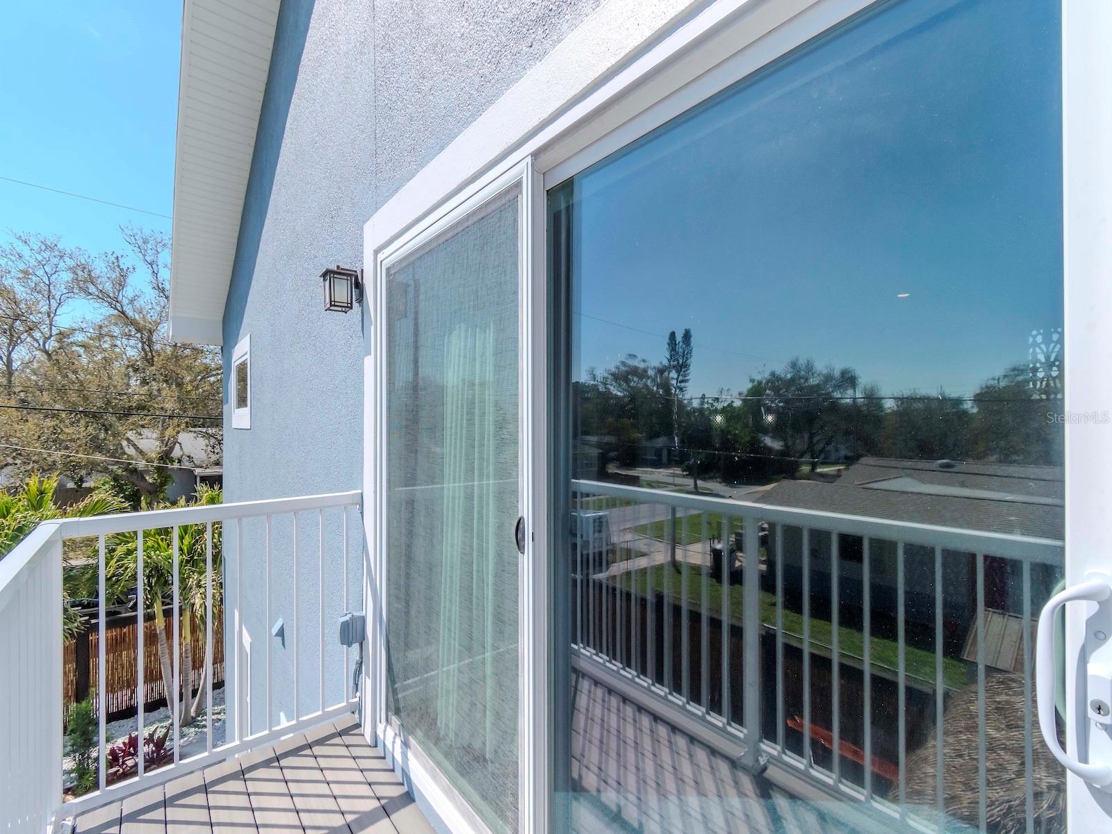 MASTER SUITE SLIDING GLASS DOORS TO BALCONY