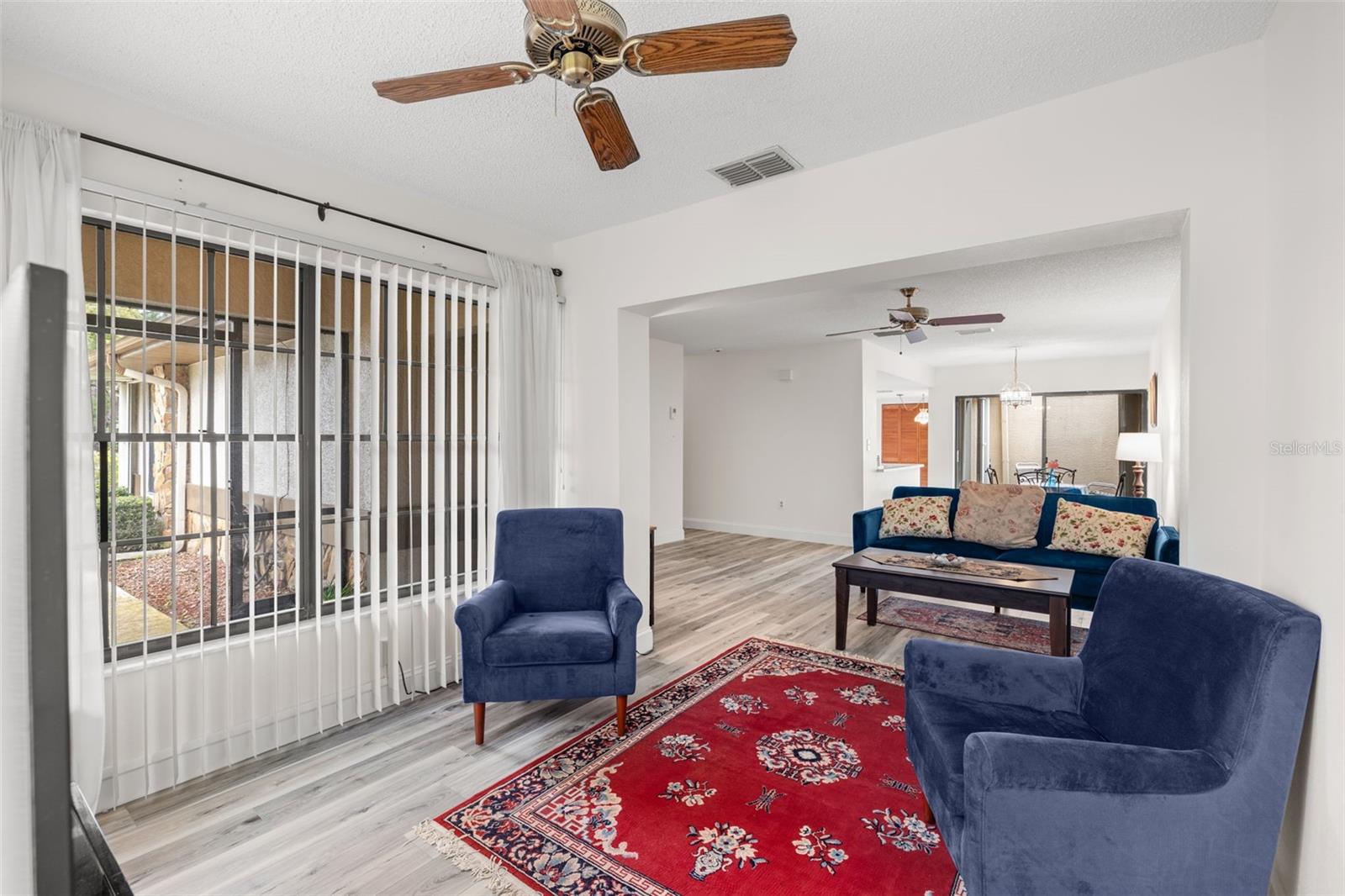 View from tv room toward the main living area and dining room.