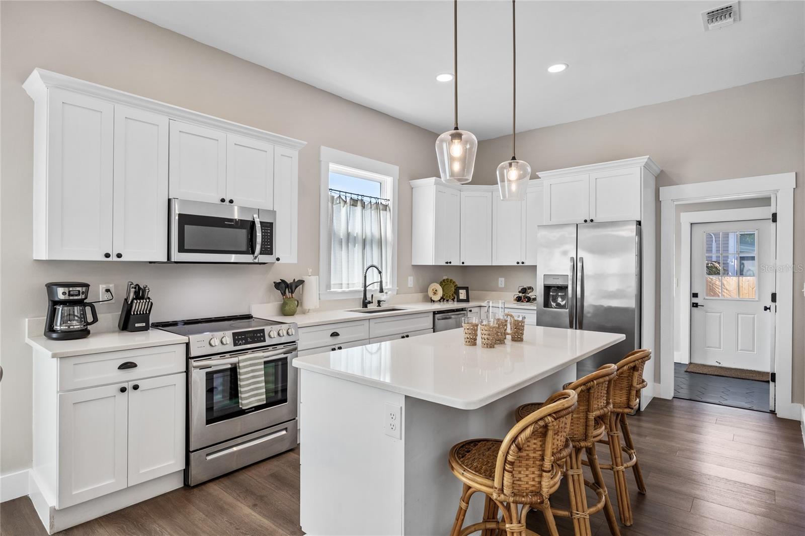 A crisp white kitchen waiting for your personalization