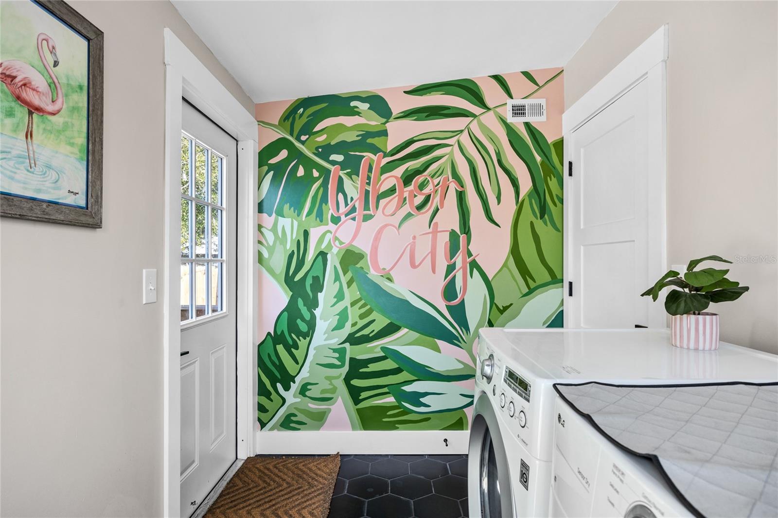 A custom mural in the laundry room/mudroom