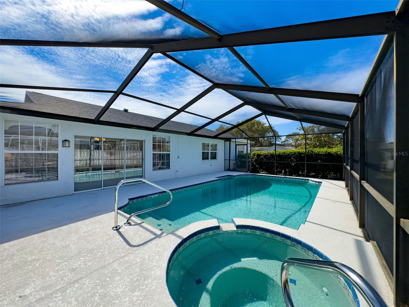 Screen enclosed pool with spa