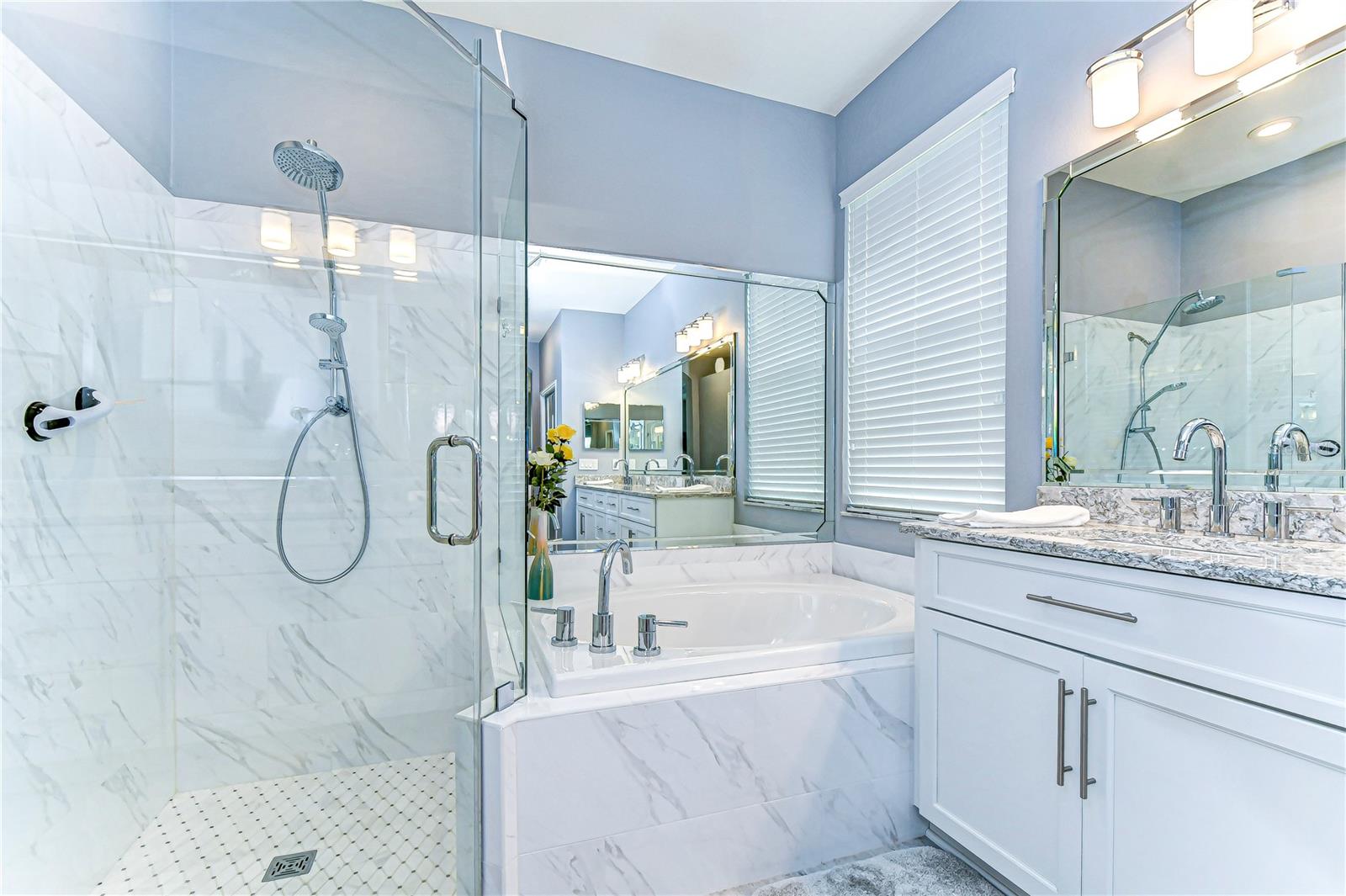 Complemented  by a spacious shower and luxurious soaking tub.