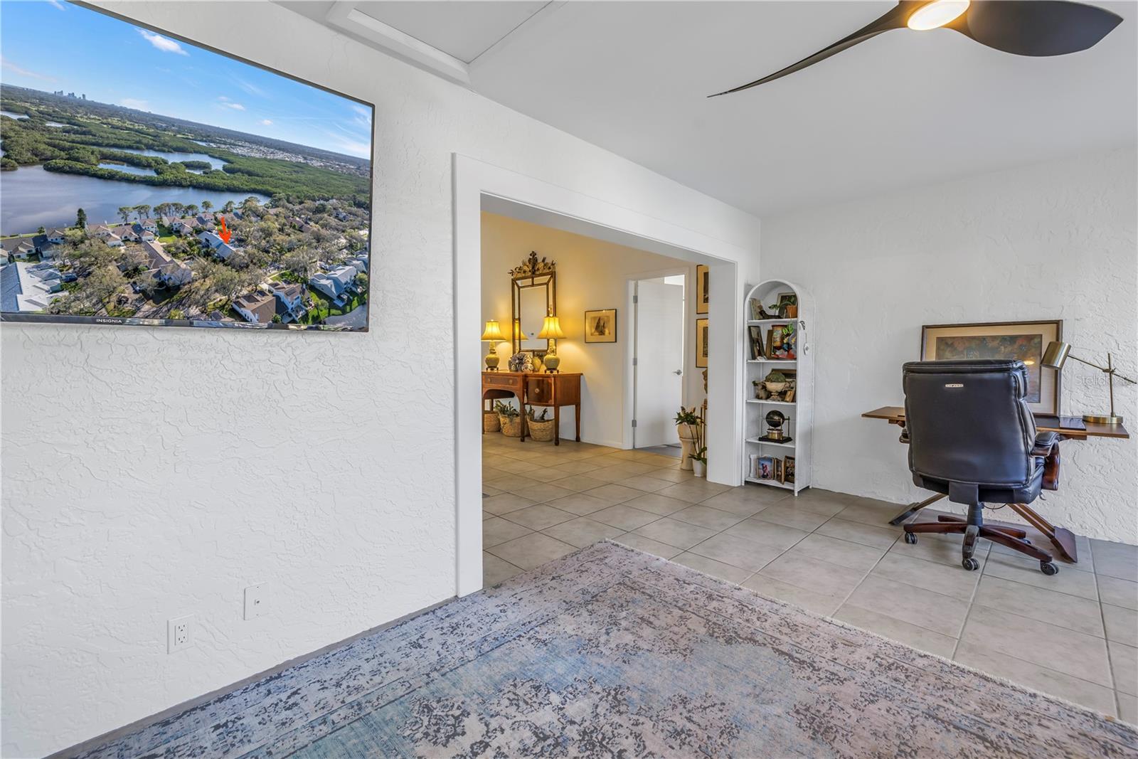Desk and chair with view of yard and Great Room