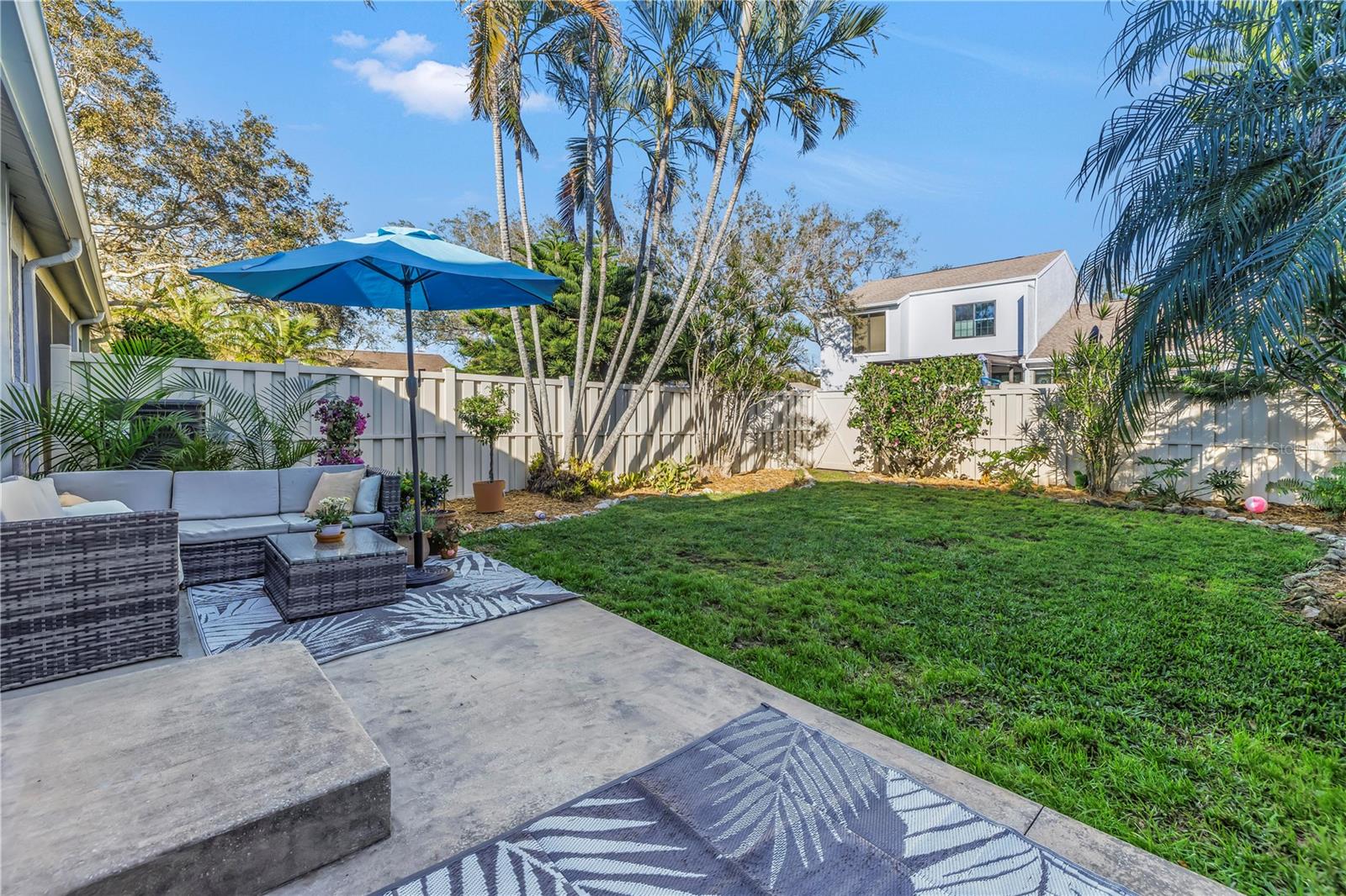 Peaceful grassy space and patio for residents and pets