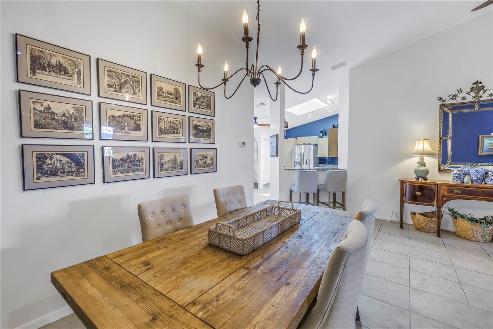Dining Space with Updated Chandelier in Great Room Layout