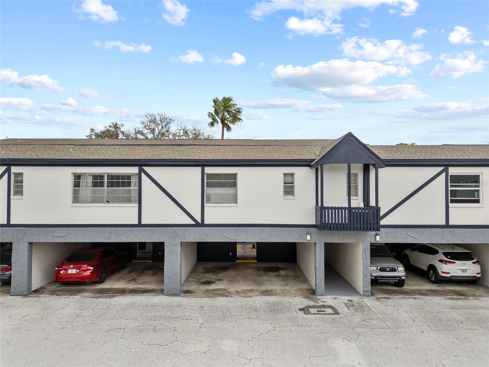 Covered parking spot with storage closet. #303