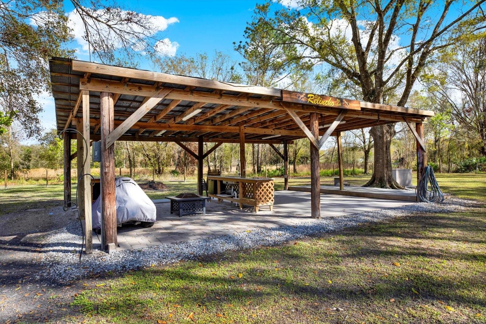 Outdoor grilling area including space to entertain.